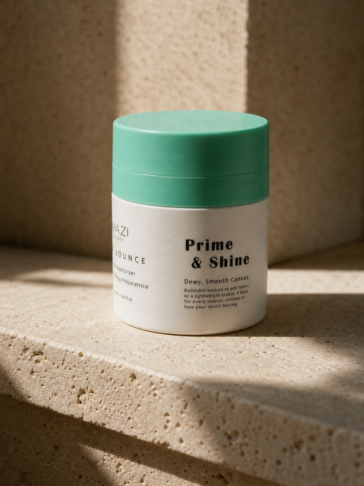 The closed Kiwi Bounce day cream jar on travertine in the midday sun